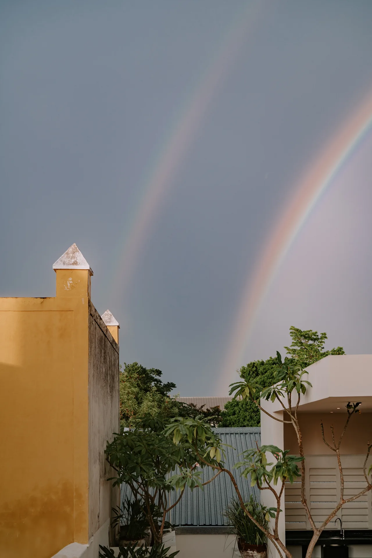 Casa Japa, rooftop with a double rainbow over the walled city — sunset in Campeche — Casonas MX
